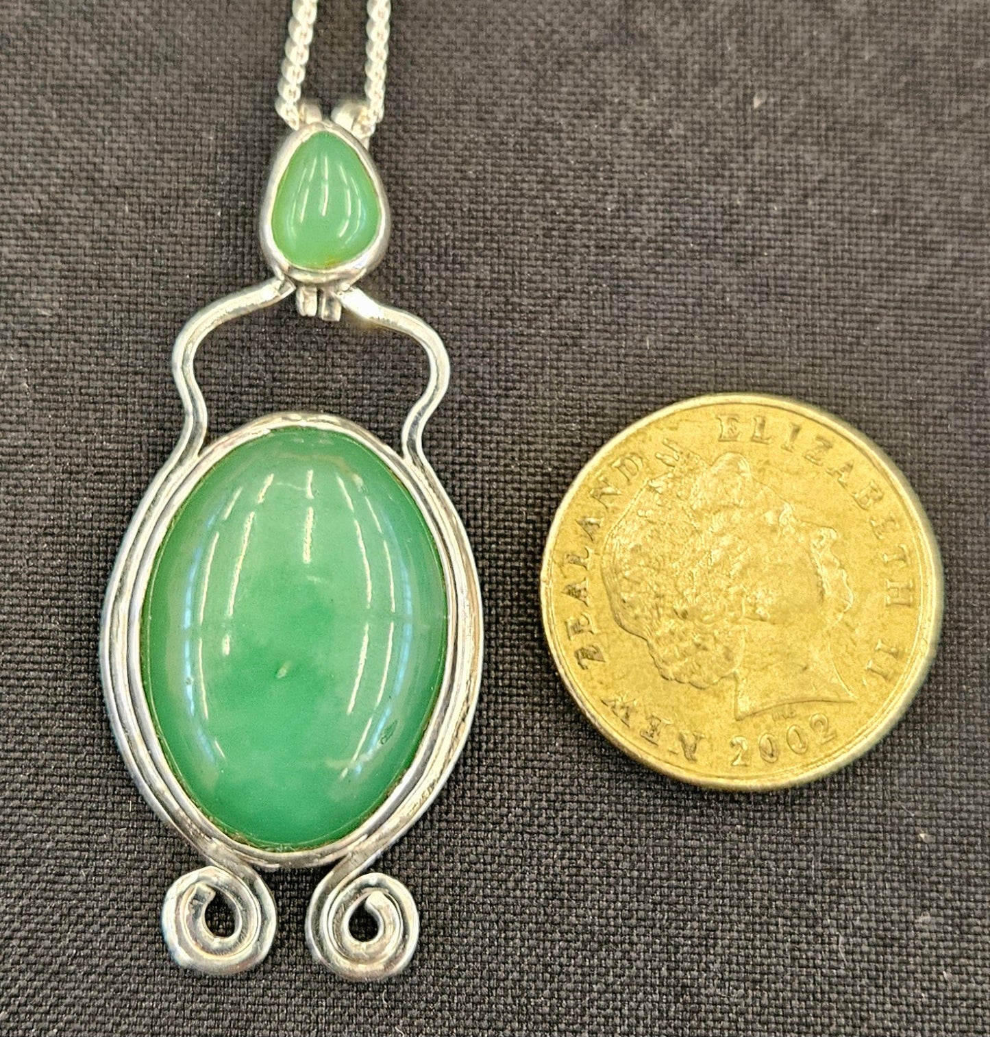 Australian Chrysoprase in sterling silver pendant with 18 inch sterling silver chain, with NZ one dollar coin for size comparison.