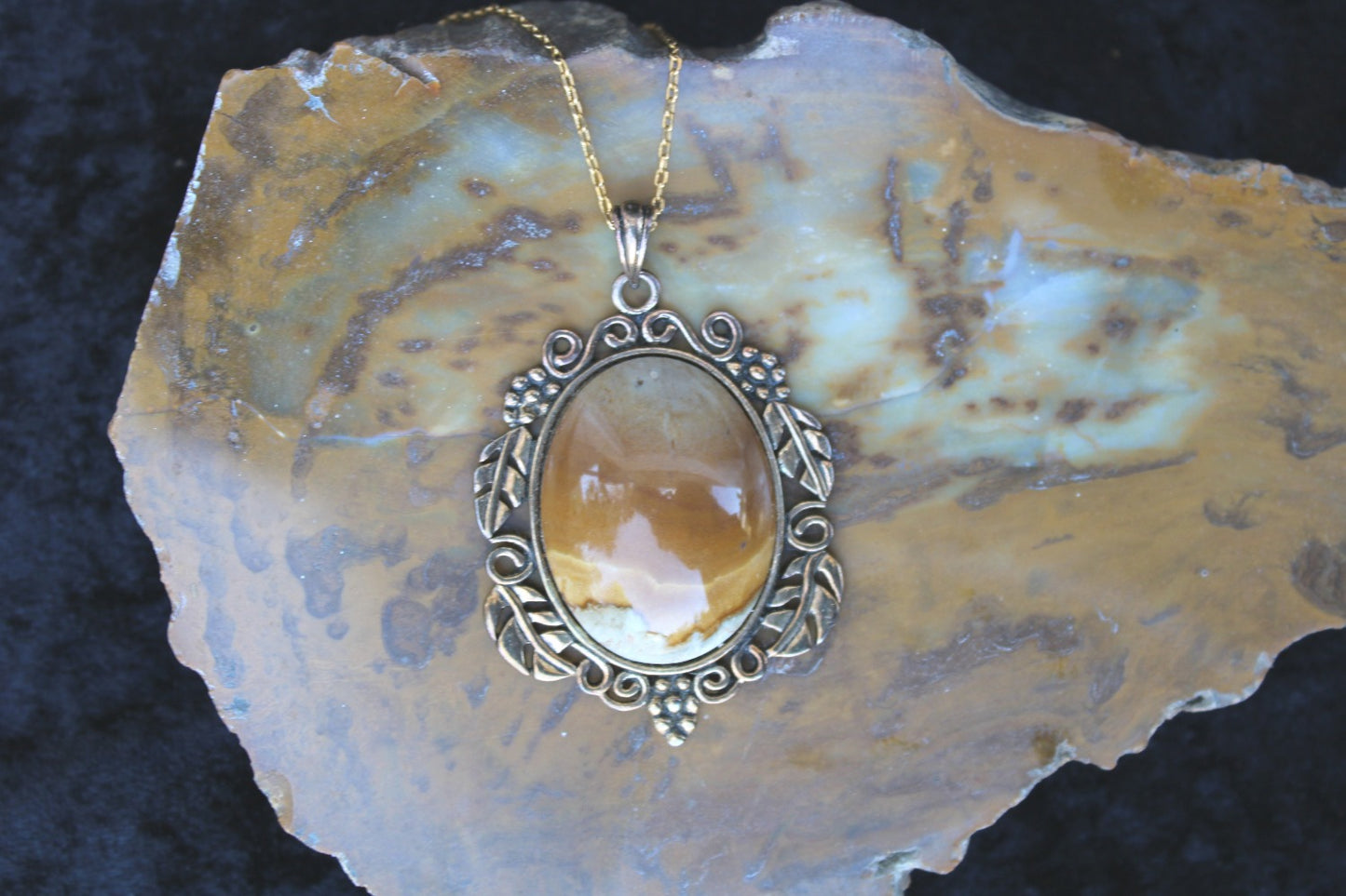 Necklace with Port Albert Concretion that I dug out of the tidal mud and when I cut this stone I found this desert scene inside. This kind of picture figuring is very rare. The stone is hand polished to a 40x30mm cabochon and set in a gold plated setting with 19 inch chain - on Table Mountain Petrified Wood