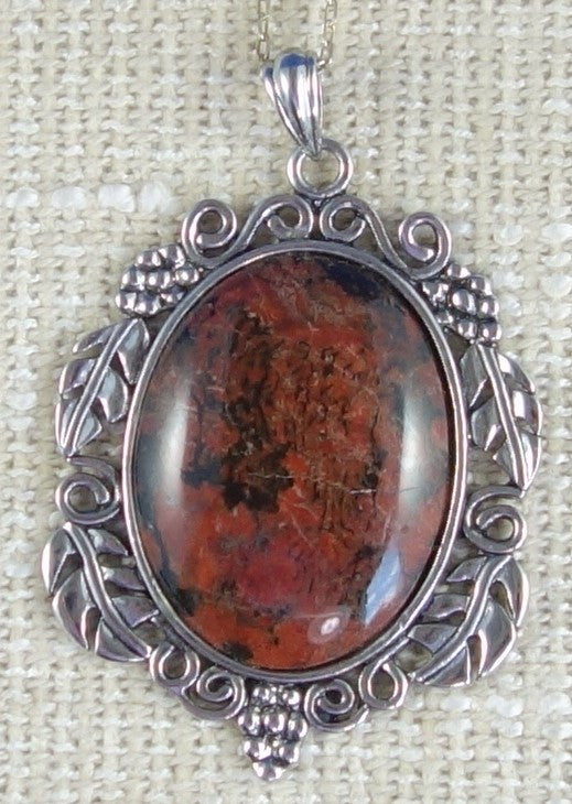 Necklace with Port Albert Concretion that I dug out of the tidal mud and when I cut this stone I found this desert scene inside. This kind of picture figuring is very rare. The stone is hand polished to a 40x30mm cabochon and set in a gold plated setting with 19 inch chain - on burlap