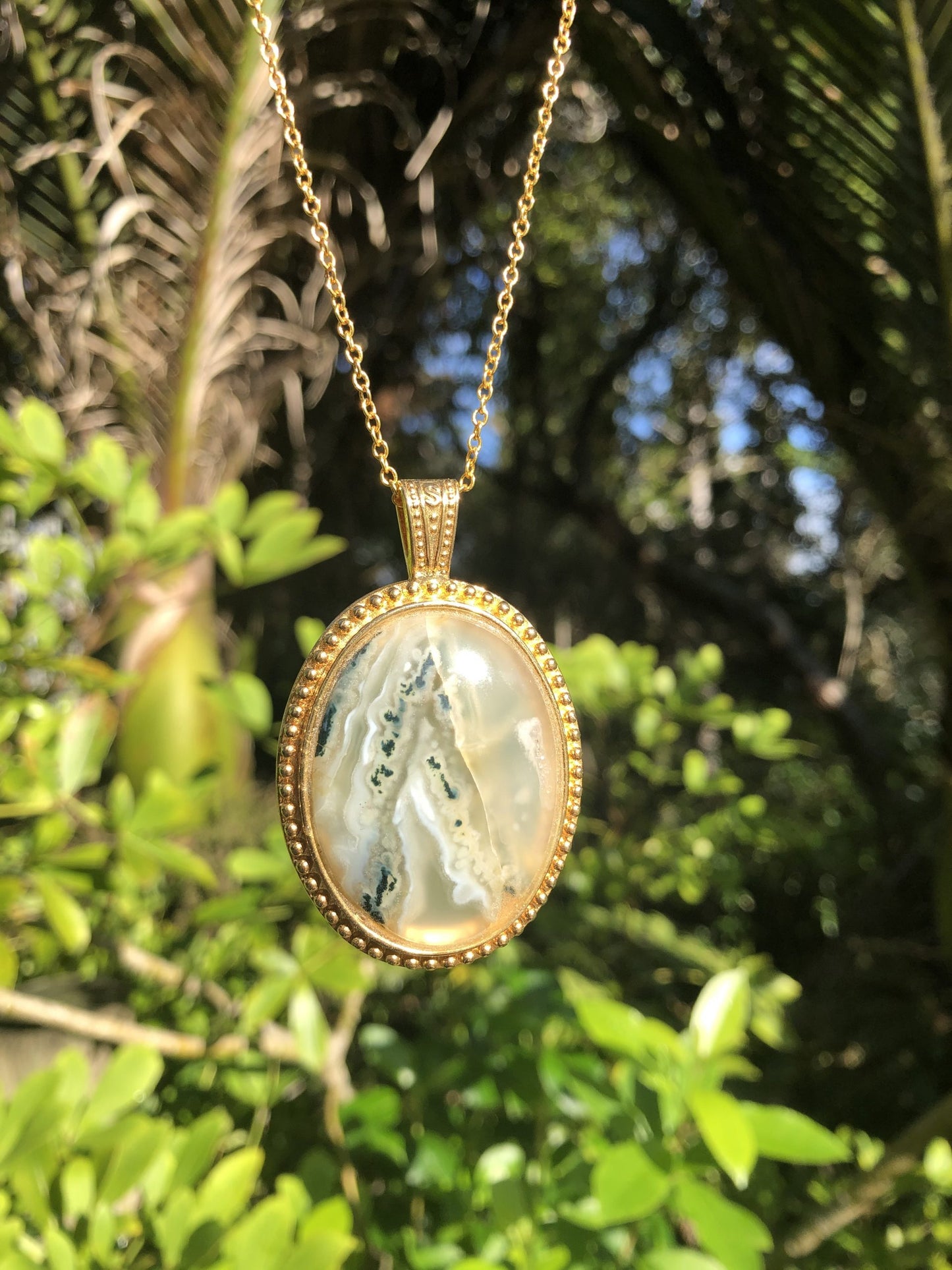 Necklace of Barossa Mountain New Zealand moss agate, hand cut into 40x30mm cabochon and set in gold plated setting with 19 inch chain