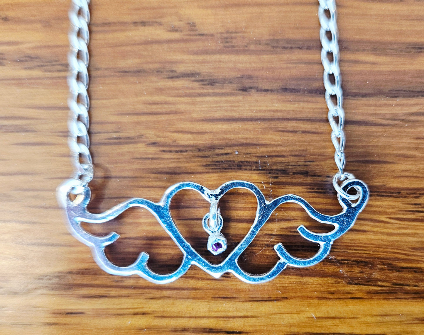 Small (40mm wide) Heart-Wing pendant with a ruby charm, all in solid sterling silver and a solid sterling silver heavy chain, straight chain.