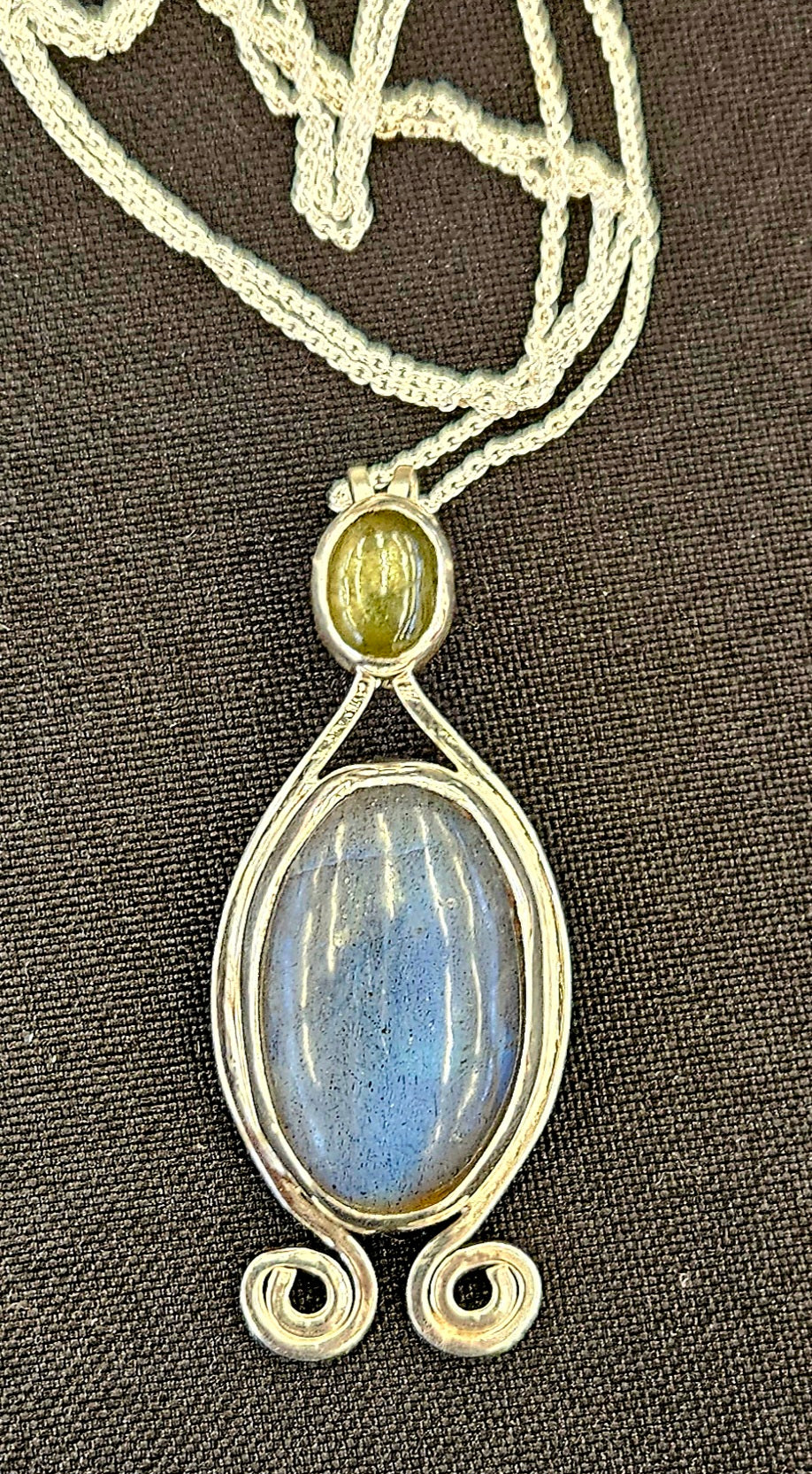 Radiant Labradorite pendant in sterling silver with glowing black star sapphire with a 18 inch sterling silver chain