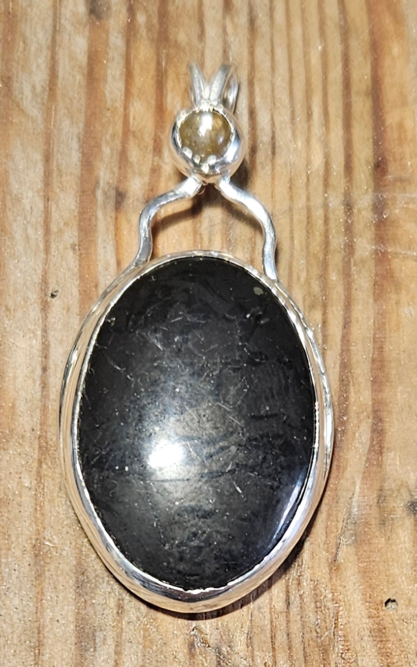 Shungite pendant with Moonstone accent in sterling silver and 18 inch sterling silver chain, pendant only.