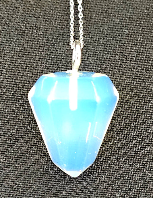 Opalite pendulum set to be worn as a necklace, so it's always handy, with a sterling silver chain on dark background.