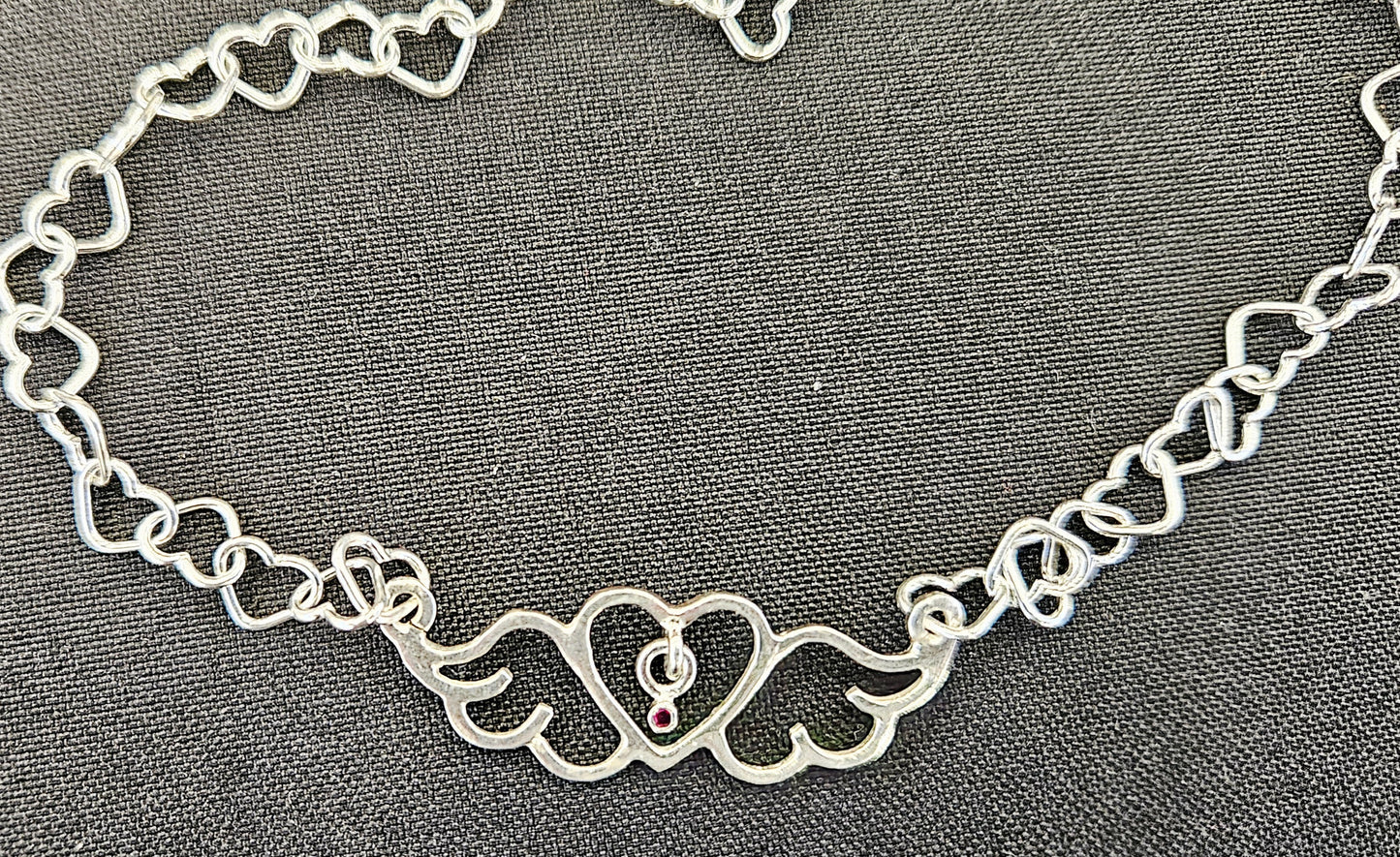 Small (40mm wide) Heart-Wing pendant with a ruby charm, all in solid sterling silver and a solid sterling silver heart chain.