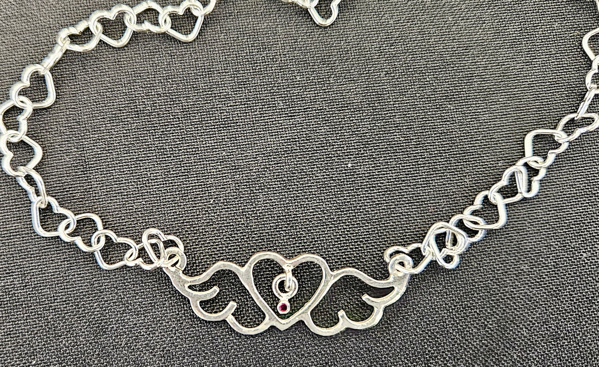 Small (40mm wide) Heart-Wing pendant with a ruby charm, all in solid sterling silver and a solid sterling silver heart chain.