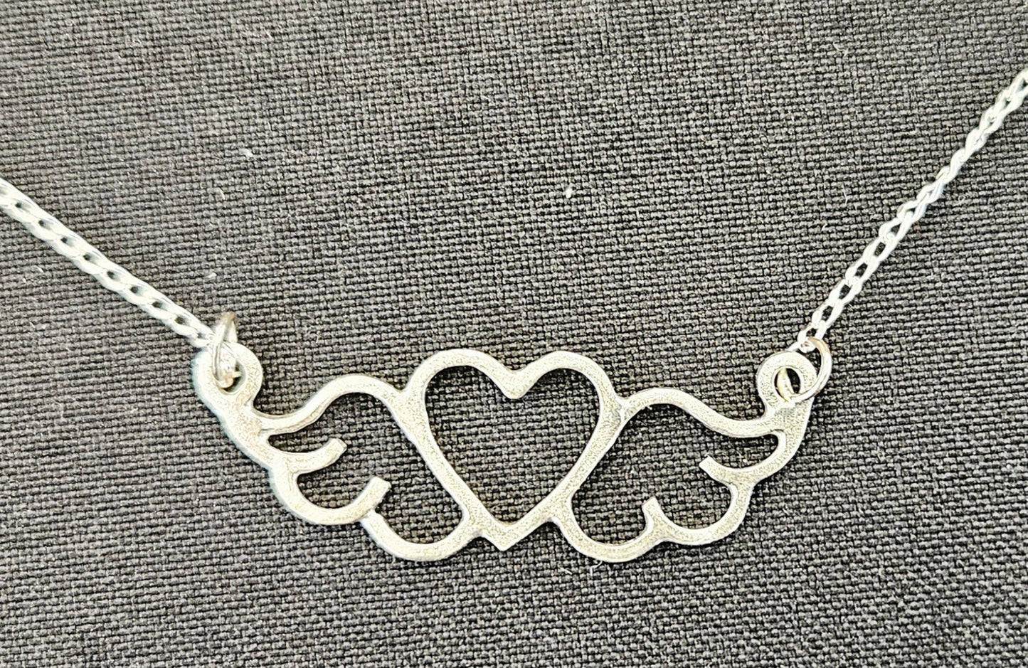 Small (40mm wide) Heart-Wing pendant in solid sterling silver and a solid sterling silver fine chain.