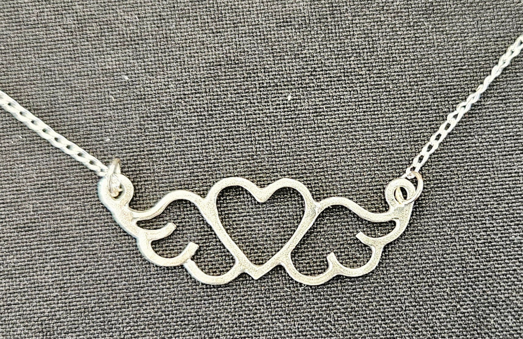 Small (40mm wide) Heart-Wing pendant in solid sterling silver and a solid sterling silver fine chain.