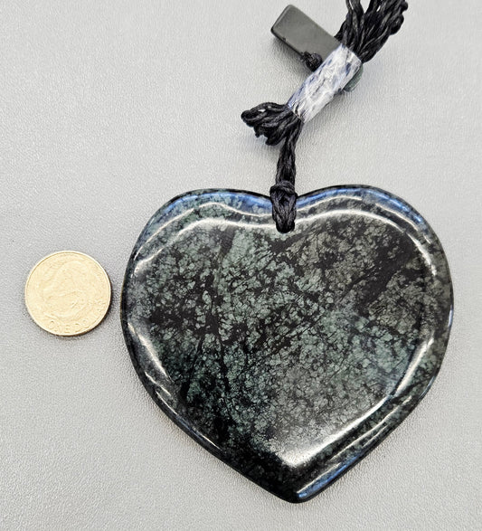 Jumbo Pounamu heart with hand braided chord and pounamu toggle with NZ one dollar coin for size comparison