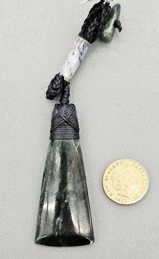 Arahura New Zealand Pounamu Toki, medium size, hand made with hand braided chord and NZ Pounamu toggle with NZ one dollar coin for size comparison.