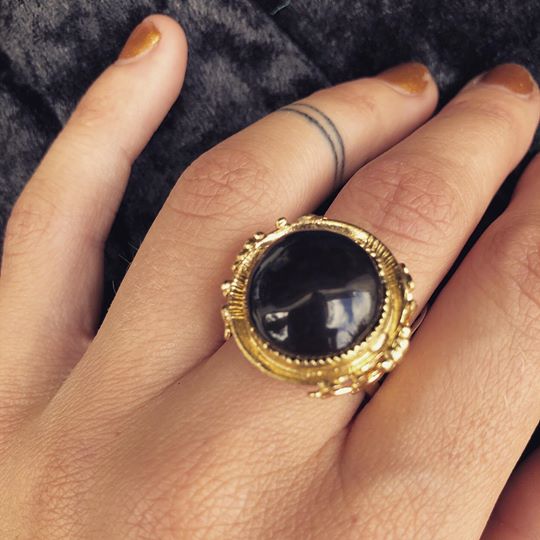 Hand cut black onyx stone in gold plated, adjustable ring