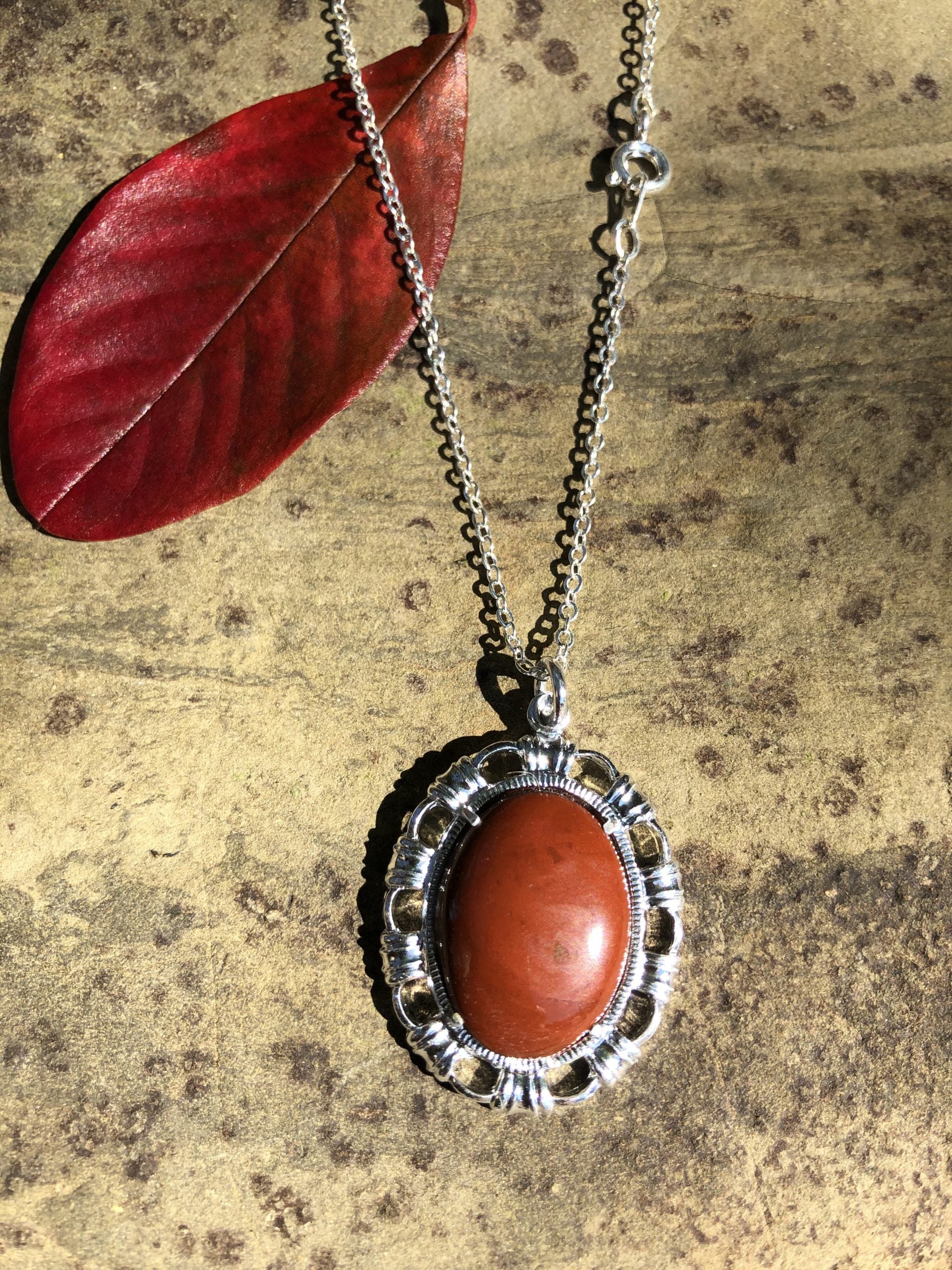 Necklace with New Zealand red Jasper, rich, deep red, hand polished to a 20x15mm cabochon and set in a silver plated setting with 19 inch chain, closer