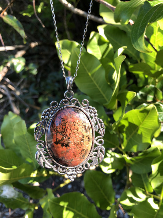 Necklace with Port Albert Concretion that I dug out of the tidal mud and when I cut this stone I found this desert scene inside. This kind of picture figuring is very rare. The stone is hand polished to a 40x30mm cabochon and set in a gold plated setting with 19 inch chain - front