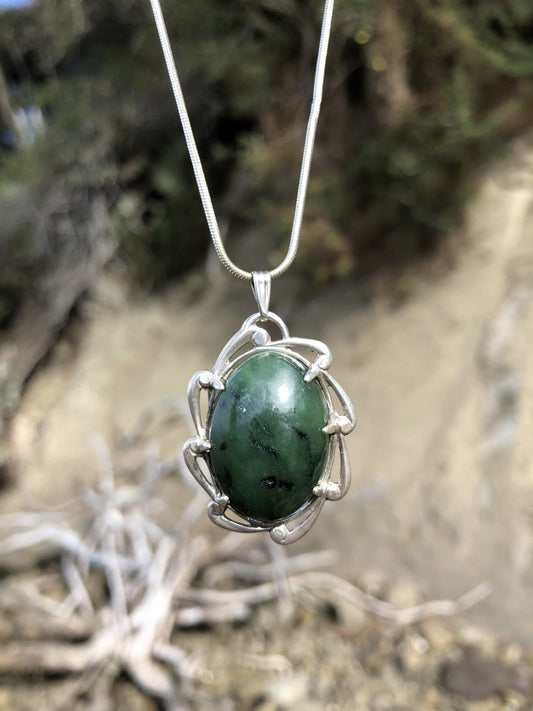Necklace with New Zealand Kawakawa jade (greenstone or Pounamu) with bright green and black markings, hand polished to a 25x18mm cabochon and set in sterling silver with 24 inch sterling silver snake chain, closer