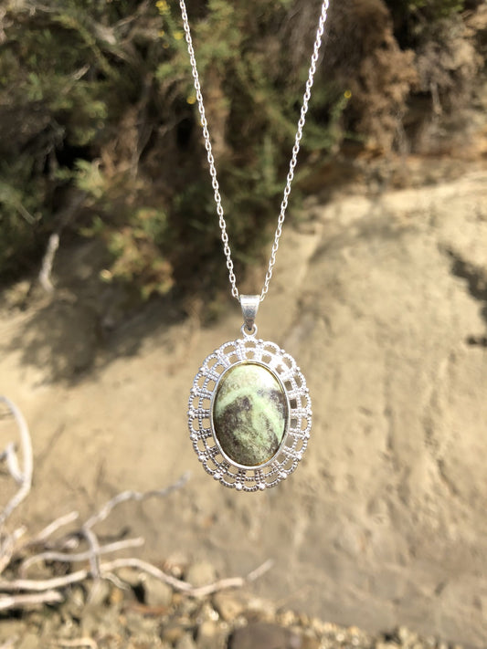 Necklace with a New Zealand Pounamu (Greenstone, NZ Nephrite) hand polished to a 25x18mm cabochon and set in a silver-plated setting with a 19 inch chain, main