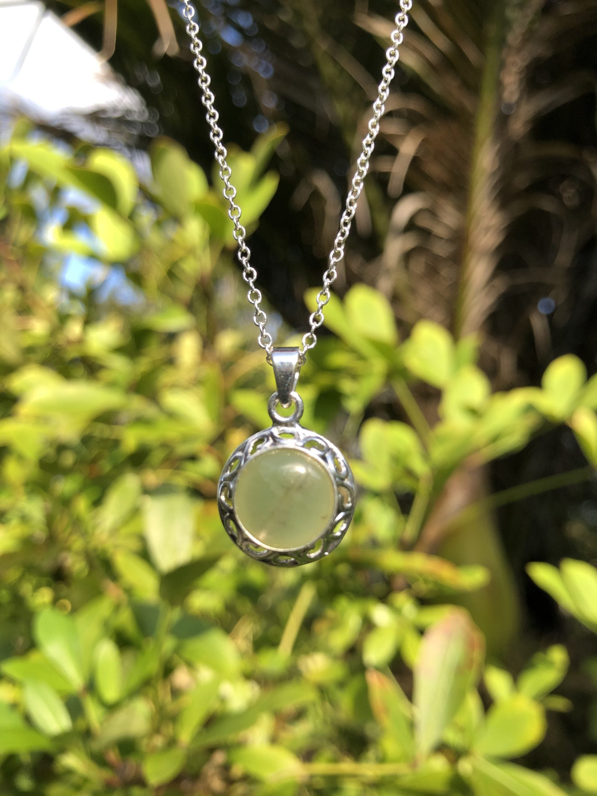 Necklace with Botswana Jade (green aventurine), hand polished to a 20mm round cabochon and set in a silver plated setting with 19 inch chain.